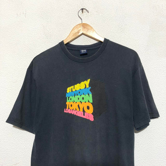 Vintage 00s Stussy T-shirt in black and multi-colour print - Medium